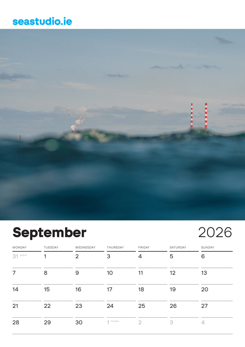 Sea Studio Calendar for September 2026 with a scenic ocean view and red and white Pigeon House Towers, Dublin.